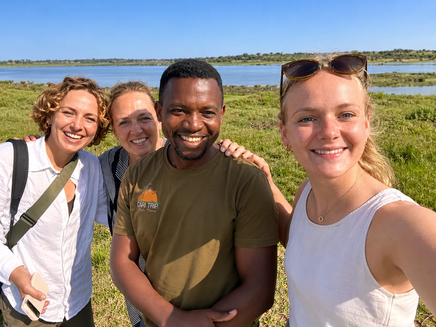 Immanuel Wamba with safari guests in Uganda
