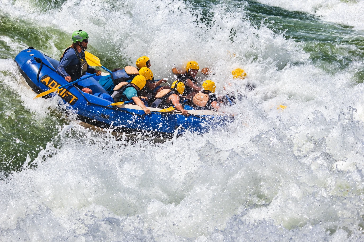 A rafting group navigating white-water rapids on the Nile